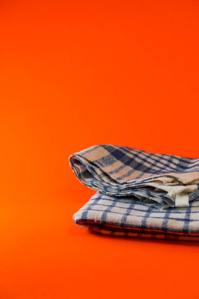 istock White washcloth on an orange background 1332728510