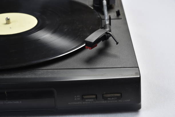 istock old vinyl record player on white background. 1332731580