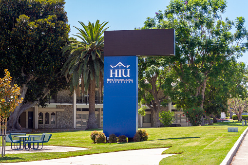 Fullerton, CA, USA – August 1, 2021: Hope International University signage and building located in the Orange County city of Fullerton, California.