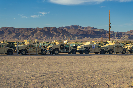 Yermo, CA, USA – July 2, 2021: Military humvee vehicles stored at an auction lot in The Mojave Desert in Yermo, California.