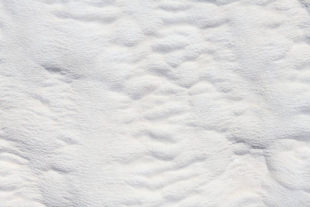 istock Natural mineral limestone blurred white background. Pamukkale travertine pools surface texture, Turkey 1332735237