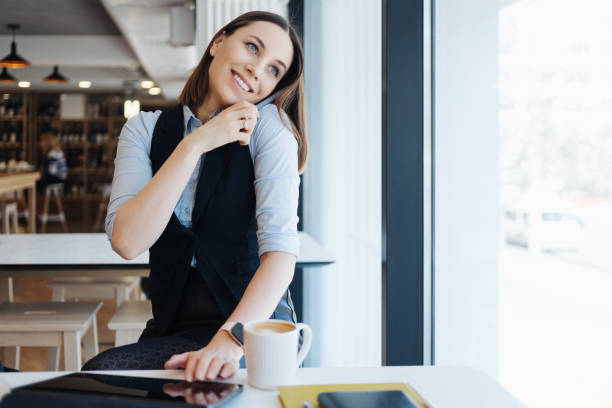 istock Caucasian beautiful woman using smart phone for business 1332739092