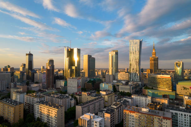 Warsaw at sunset. The capital of Poland is illuminated by a beautiful orange sun. stock photo