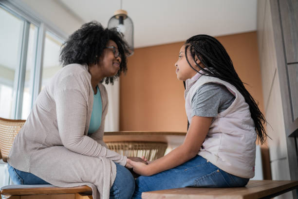istock Mother talking to daughter at home 1332741488