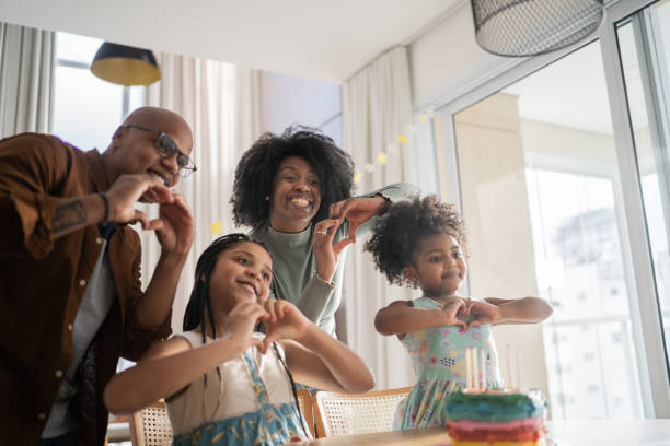 Family celebrating birthday virtually at home