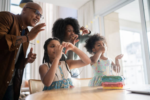 Family celebrating birthday virtually at home