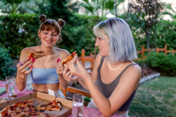 istock Best Friends having pizza party at outside 1332745825