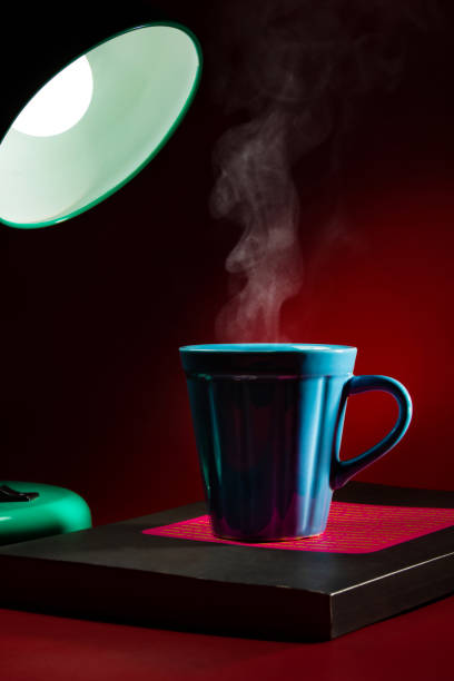 istock A lamp illuminating a mug with coffee. 1332746548