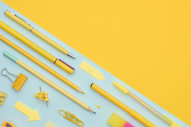 istock Office stationery on a two-tone background with space for text. 1332753042