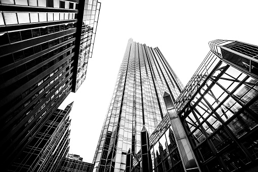 London, England - Oct 16, 2023 - Upward view of Skyscrapers in the business district area of One Canada Square in Canary Wharf. Tall structure architecture in the capital city. Architectural exterior view, Copy space, Selective focus.