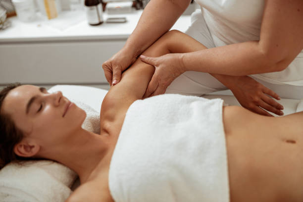istock Beautiful young woman receiving professional massage in spa salon 1332755708