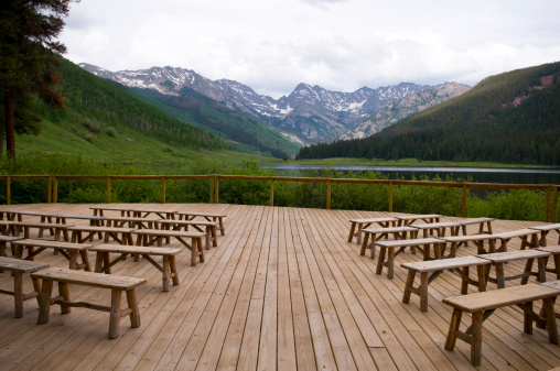 Beautiful Wedding Deck Overlooking Mountains and Lake with Benches