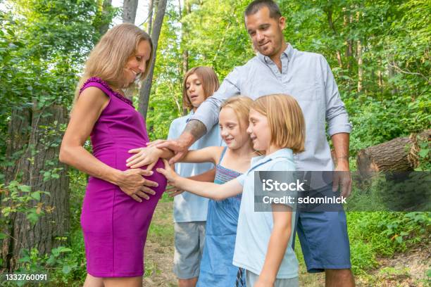 Father And Children Touching Pregnant Moms Belly Stock Photo - Download Image Now - 40-44 Years, Abdomen, Adult