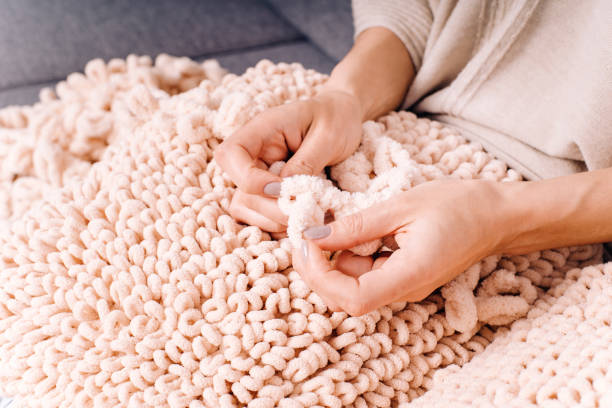 istock Knits made from thick soft yarn. Soft knitted cushions made of thick yarn. 1332762955