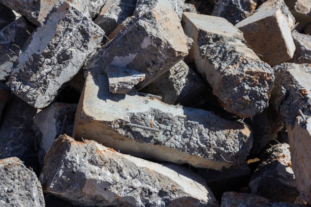 istock Broken concrete pillars. Fragments of used broken concrete. Construction material 1332763021