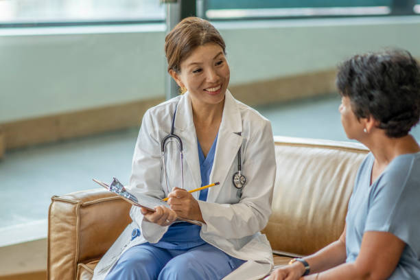 istock Woman consults her doctor 1332763361