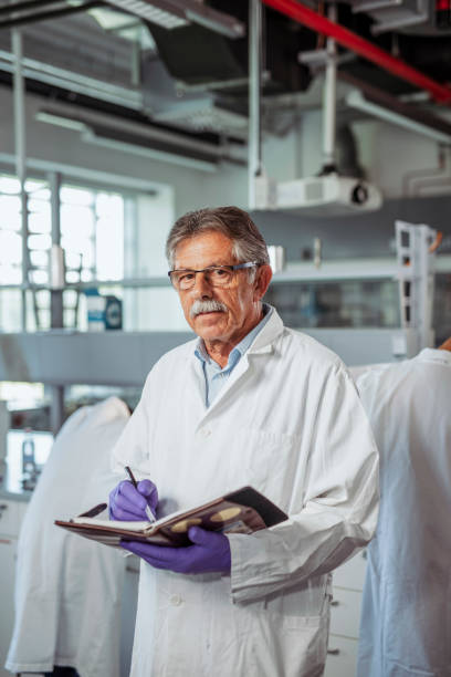 istock Senior University Professor in Lab with Personal Organizer 1332763975