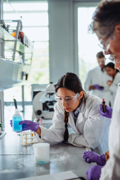 istock University Student Creating Chemical Reaction and Vapor 1332763981