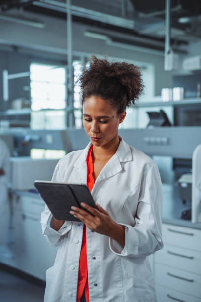 istock Young Mixed Race University Student Working in Laboratory 1332763989