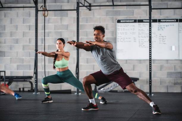 istock Focused Black and Mixed Race Athletes Working Out at Gym 1332764031