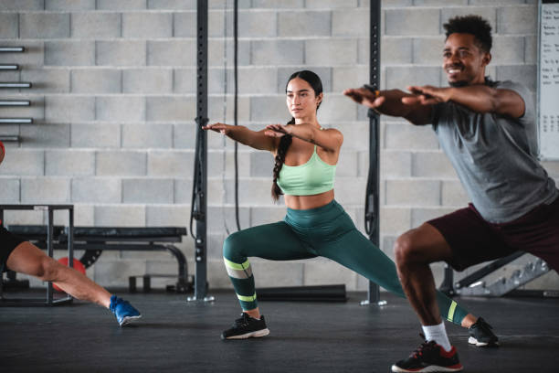 istock Mixed Race and Black Athletes Doing Side Lunge Exercises 1332764044
