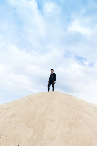 istock man in desert dunes 1332777724