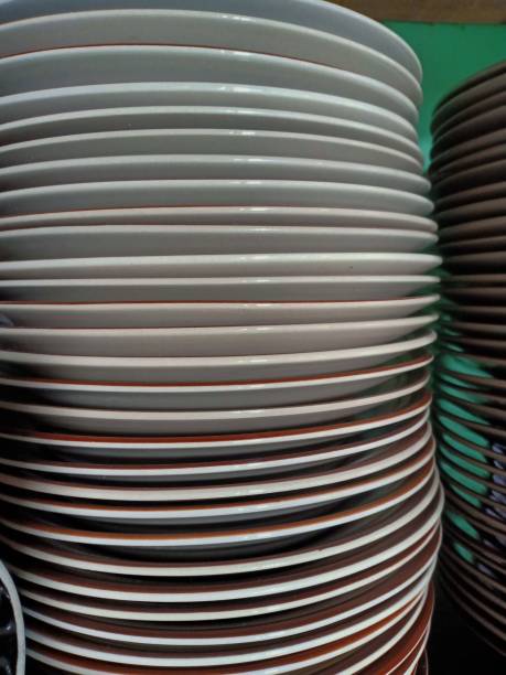 istock pile of ceramic dinner plates 1332778665