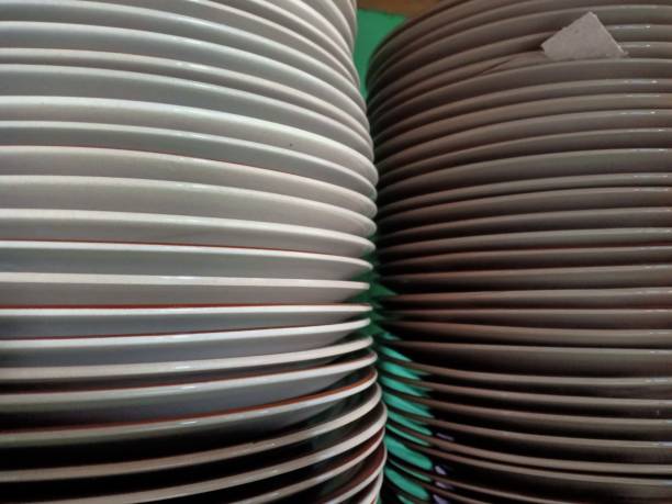 istock pile of ceramic dinner plates 1332778679