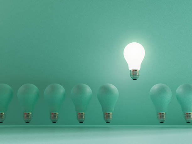 istock One lightbulb shining and rising above on others bulbs on blue background for outstanding ,different creative thinking idea and innovation concept by 3d render. 1332787800