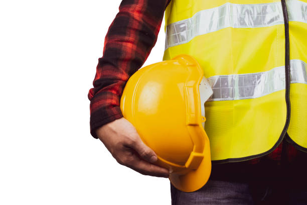 istock Close up engineering man standing with Yellow safety helmet Isolated on white background 1332789560