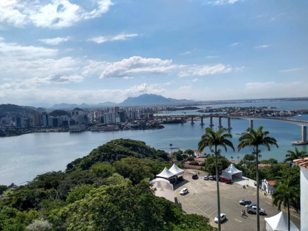 View of the city of Vila Velha and Vitória from the Convento da Penha. Tourist location. Convento da Penha is a place of great historical, religious and tourist importance. It is possible to have a beautiful view of the Brazilian cities of Vitória and Vila Velha. It is also possible to see the bridge connecting the two cities. convento stock pictures, royalty-free photos & images