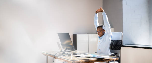 istock Arms Stretch Exercise Sitting At Desk 1332792351