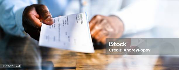 African Business Man Giving Paycheck Stock Photo - Download Image Now - Paycheck, Check - Financial Item, Bank Deposit Slip