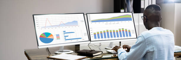 istock African American Business Desktop Looking At Graphs 1332793089