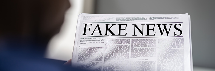 African Man Reading Fake News Newspaper Headline