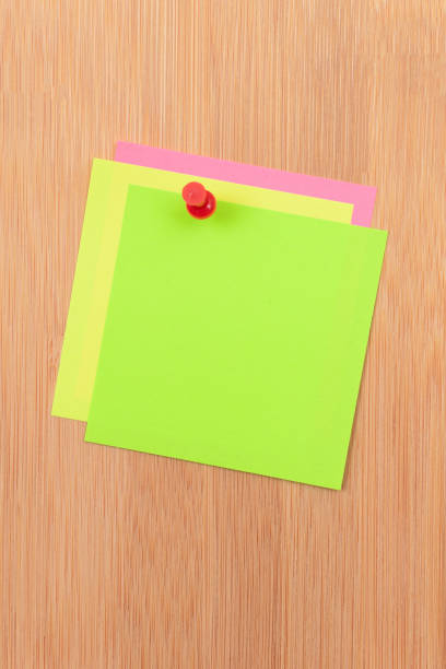 istock Colored Sticky Notes Pinned to the Wooden Message Board 1332793690