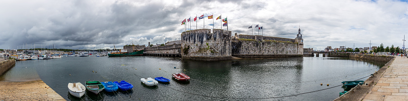 Concarneau (Brittany) - Old village with low tide\n\nAll logo's and recognizable people have been removed or blurred.\nThis high resolution panorama image has been created out of 18 individual photos that have been stitched in Adobe Lightroom