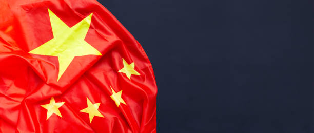 istock Chinese flag on dark background. 1332795409