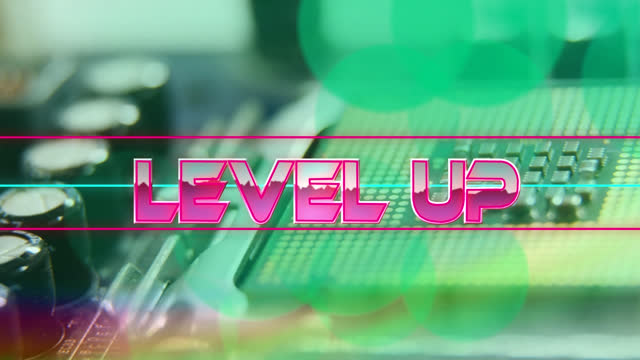 Level up text on neon banner against close up of microprocessor connections on motherboard