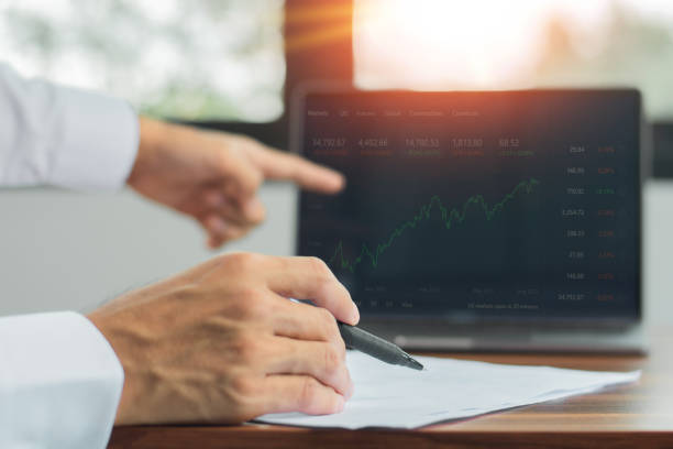 istock Businessman monitor digital graph chart trade online on computer, Trading online 1332802462