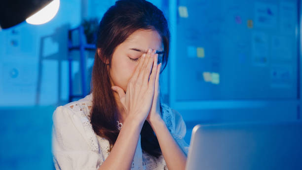 istock Freelance Asia women using laptop hard work at new normal home office. 1332802563