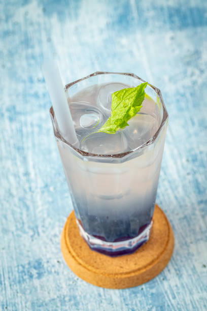 istock Fruity Bubble Tea in glass cup on blue background 1332802712