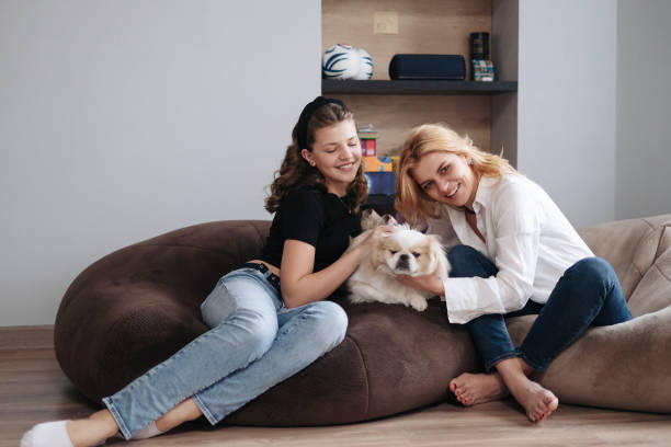 istock Mother, daughter and adorable dog 1332804567