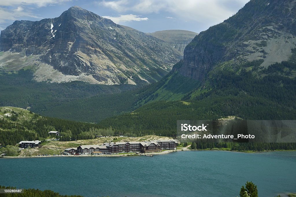 Many Glacier Hotel on Turquoise Swiftcurrent Lake Blue Stock Photo
