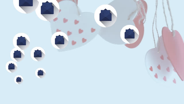 Multiple message icons floating over hanging heart shape decorations against white background