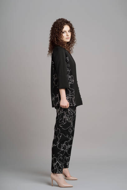 istock Curly woman portrait on gray background 1332805788