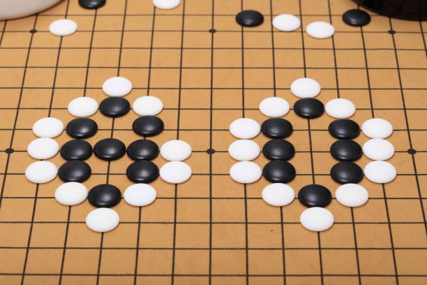 istock chinese game go,  Gobang and go game board 1332805960