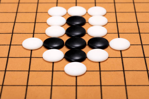 istock chinese game go,  Gobang and go game board 1332806489