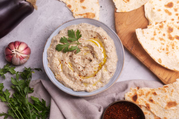 istock Baba ganoush baked eggplant with sesame paste with ingredients close-up top view 1332810811