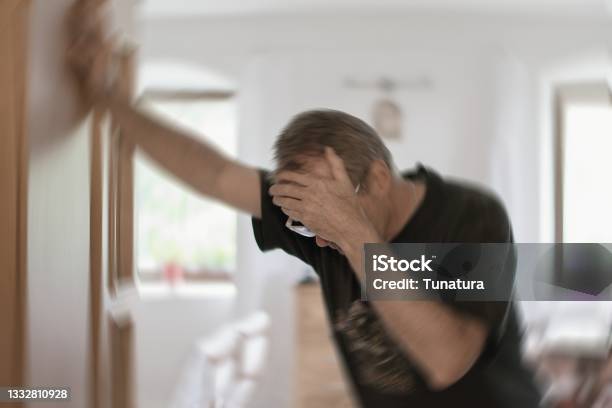 Man Suffering From Vertigo Or Dizziness Or Other Health Problem Of Brain Or Inner Ear Stock Photo - Download Image Now
